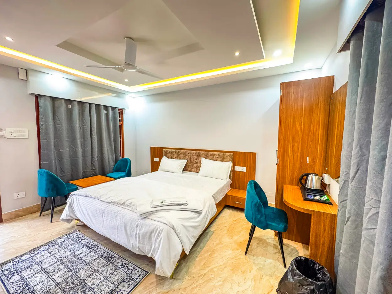 Elegant deluxe cottage with king-size bed at Rivero Resort Dirang